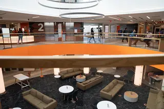 Students can look down at Schine's first floor lounge from the second floor balcony.