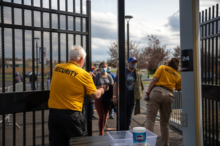 Security personnel open the gates of NBT Bank Stadium so fans can enter and watch the opening day game.