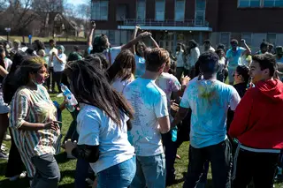 Music plays as students dance at SASA's Holi celebration at the Women's Field Saturday. 