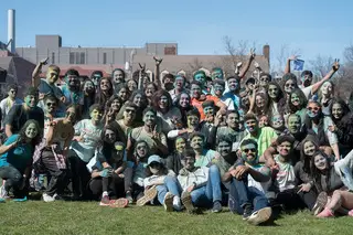 Students in attendance of the SASA Holi Celebration gather for a photo after the color throwing at the event. 