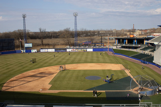 Members of the grounds crew prepare the field before the game. 