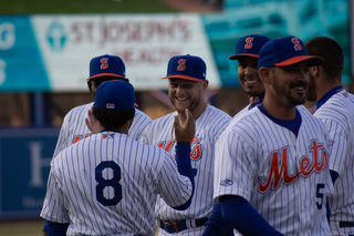 Players on the Mets hype each other up before the game in hopes of securing their first win of the season. 