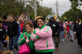 Two friends pose during the Syracuse Victory Parade as part of the Juneteenth celebrations, June 18th, 2022.