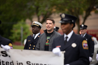 Mayor Ben Walsh walks with the Syracuse Police Department in the Syracuse Victory Parade as part of the Juneteenth celebrations, June 18th, 2022.