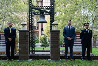 Ben Walsh, center, the mayor of Syracuse, stands alongside members of the Syracuse Police and Fire Departments during a memorial service in remembrance of the victims of the 9/11 attacks in Fayette Firefighters Park. 
