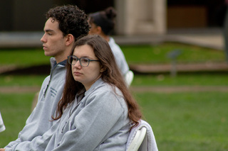 The silence of the cohort fills the quad so the only talking done by passers-by is in hushed whispers. Remembrance Scholars Louis Smith and Taylor Stover reflect on the lives of the students they represent while seated in the silence. 