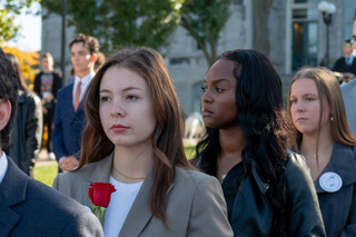 Sasha Temerte waits among her fellow 2022 Remembrance scholars to read her statement to the crowd. Temerte placed her rose in honor and memory of Karen Lee Hunt, one of the 35 Syracuse students who died during the December 21, 1988 terrorist attack on Pan Am flight 103. 