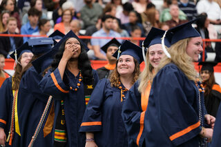 Video cameras in the Dome captured graduates as they walked in and broadcast images on the big screens. Laughter and cheers filled the Dome from the stands as supporters echoed their enthusiasm. 