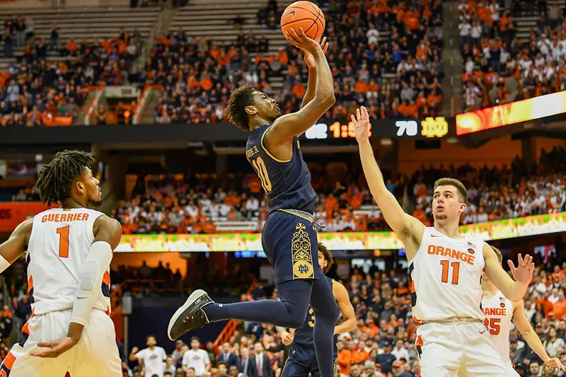 Notre Dame's 6-3 senior guard, T.J. Gibbs played very well in his team's win over Syracuse, and he jumped on them early by making a barrage of threes early on in the first half. (Photo: ND Athletics, via The Daily Orange.)