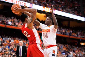Kaleb Joseph pressures Cornell's Shonn Miller as he tries to get off a pass. The Syracuse defense was suffocating all night, holding the Big Red to only 44 points.