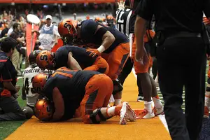 Syracuse celebrates its overtime win over CMU. Walk-on QB Zack Mahoney played a significant role. 