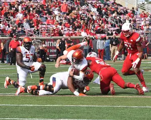 Eric Dungey dives forward during Syracuse's blowout loss to Louisville on Saturday. The freshman quarterback struggled against the Cardinals as SU dropped to 3-6.