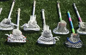 Many of the Syracuse lacrosse players have different ways they like to have their sticks strung.