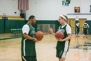 Tobias Dixie (left) stands with his partner, Rachel Hance on the at Fayetteville-Manlius high school basketball court.