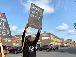 Demonstrators marched from Dr. King Elementary School to the district's office on Harrison Street. 