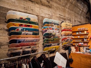 The shop sells skateboard equipment as well as clothes and merchandise designed by local artists and national brands. 