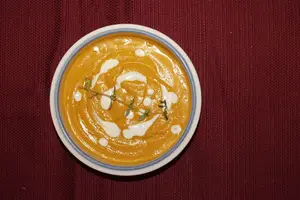 This carrot ginger soup is the perfect fall recipe, made with coconut milk and seasoned with thyme.