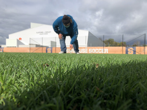 The group of groundskeepers does year-round work on the soccer field in order to maintain its mint condition and handle 22 home games in 2021. 