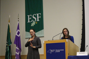 Sarah Osgood (right), the executive director of the Climate Action Council, presented the draft scoping plan before community members shared their comments.