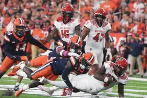 Bowl-eligible No. 14 Syracuse is heading into a showdown with No. 5 Clemson at Death Valley. Our beat writers are split on which team will continue their perfect record.