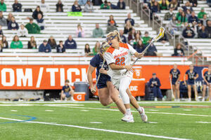 Megan Carney aims a shot on goal during Syracuse's 15-7 win over Notre Dame. Emma Ward led all attackers with a career-high in points and assists. 