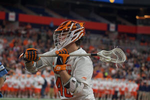 Syracuse's Cole Kirst cradles the ball and looks for a shot. The Orange found a lot of its offensive success at the X in its 16-8 win over Hofstra.