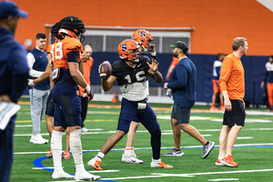 Justin Lamson and Carlos Del Rio-Wilson took turns running Syracuse’s offense as  SU rotated its quarterbacks and running backs during the first look at 11-on-11 football this spring.