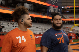 Syracuse offensive linemen Kalan Ellis (right) was ruled out for the season with a lisfranc injury, Dino Babers announced on Monday. 