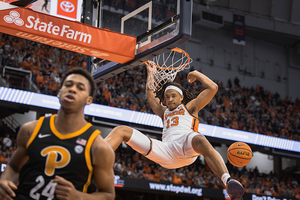 Benny Williams flexes after an emphatic two-handed jam. Williams scored 15 of SU's 52 bench points in its win over Pitt.