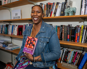 Jenn M. Jackson in their office in Eggers. Jackson, assistant professor in the Political Science department, based their book on a course they teach at SU: “Black Feminist (Insurgent) Politics.”