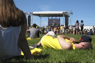 A festival goer takes a nap during The Neighbourhood's set.