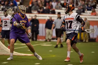 Syracuse attack Dylan Donahue patrols the area behind the Great Danes' crease.