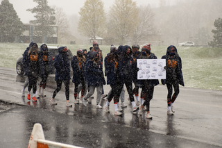The SU volleyball team marches on South Campus, from Skytop to Coyne Stadium, in support of justice for Black athletes, administrators, coaches and students.