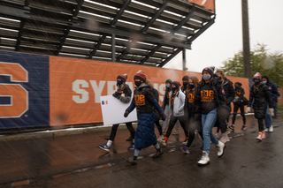 The women's cross country team marches to Coyne Stadium as part of the Black Athletes Lives Matter march organized by the Diversity and Inclusion Student-Athlete Board and the Student-Athlete Advisory Committee.