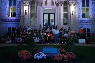 The crowd gathered on the steps of the Hall of Languages on the Syracuse University campus. Survivors told their stories to the crowd, often in tears.