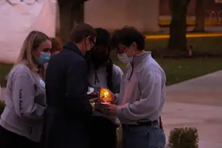Dean of Hendricks Chapel Rev. Brian Konkol lights candles for everyone at the vigil.