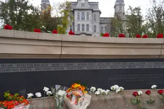 Roses and other flowers remain on and around the Wall of Remembrance after Remembrance and Lockerbie Scholars, as well as others who came to honor the lives of those lost in the Pan Am Flight 103 terrorist attack, gathered for the Rose-Laying Ceremony.
