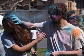 Students gathered in the Women's Building Field to celebrate Holi at Syracuse University on Saturday, April 8, 2023. 